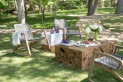 outdoor chairs around a burl wood table