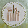 Alain Saint Joanis Dunes Silverplate 5 Piece Flatware Set displayed on placemat and tablecloth