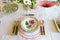 Sabre Paris Bistro Flatware in Tortoise styled on napkin and placemat with tabletop setting