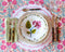 Italiano Bloom Deep Plate in Pink paired with dinner plate, placemat, flateware on top of tablecloth