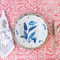 Starry Nights Deep Plate, Blue, on top of dinner plate, set with flatware, napkin, and glass
