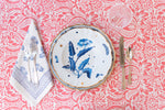 Jasmine Blue Napkin displayed with flatware, accent plate, dinner plate and glassware on top of tablecloth