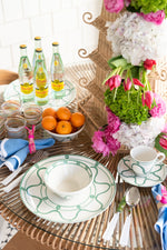 Poros Cup and Saucer, Fern styled on table with poros dinner plate in fern and poros bowl in fern