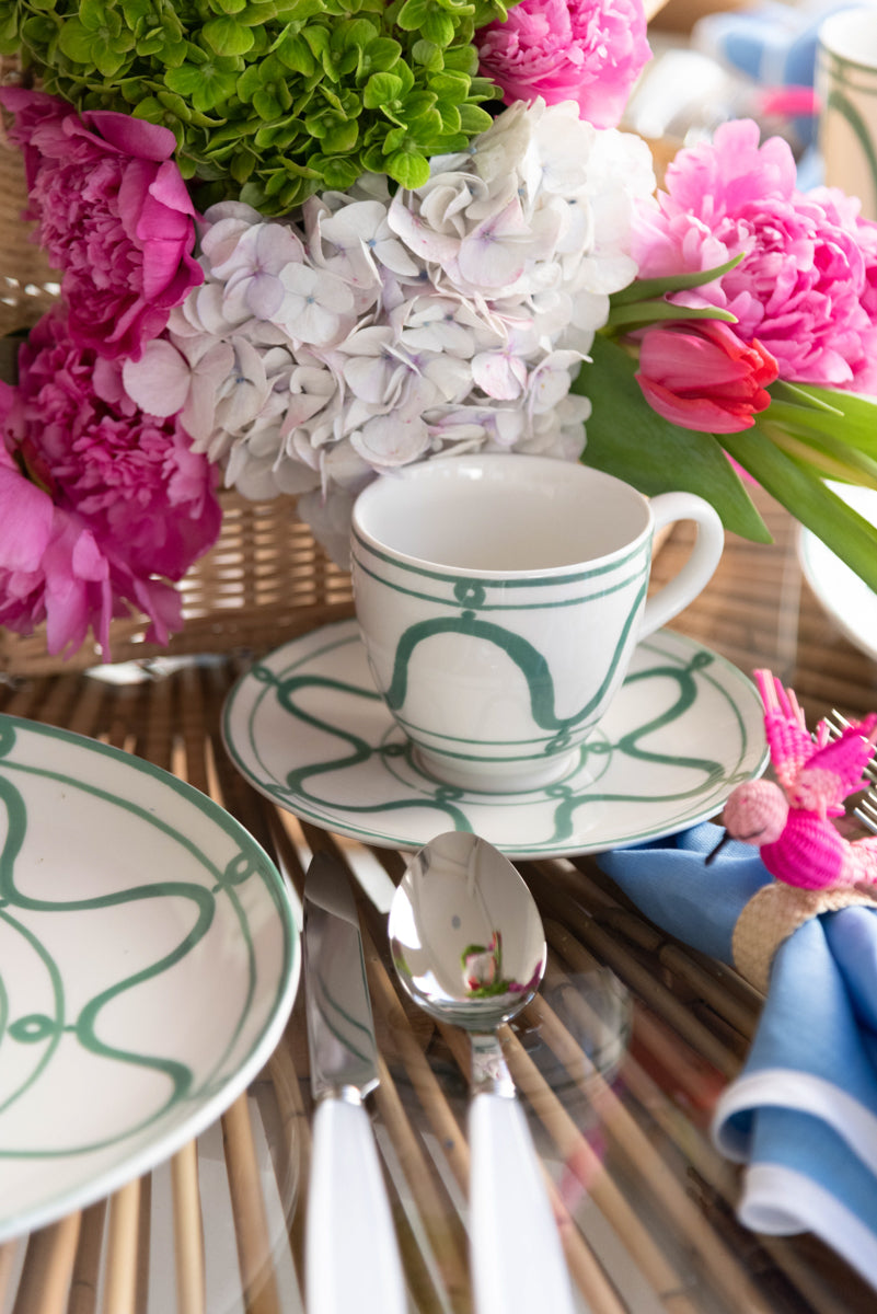 Poros Cup and Saucer, Fern on table in front of floral pagoda