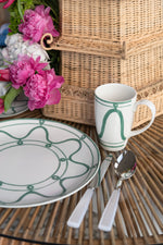 Poros Mug, Fern, on table with poros dinner plate and white flatware