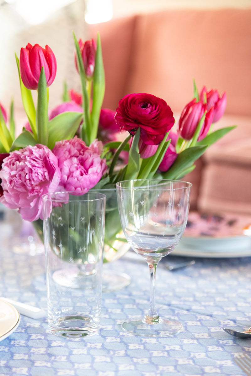 Celestial Wine Glass paired with high ball on table display