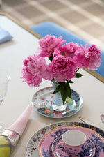 Mottahedeh Tobacco Leaf Bread and Butter Plate with flowers in a glass vase on top