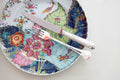 Mottahedeh Tobacco Leaf Dinner Plate with fork and knife on top