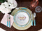 Aerial view of Raynaud Paradis Turquoise Dinner Plate styled with accent plate, flatware, placemat and napkin