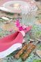 Woven Hummingbird Napkin Ring on pink scalloped napkin on table setting