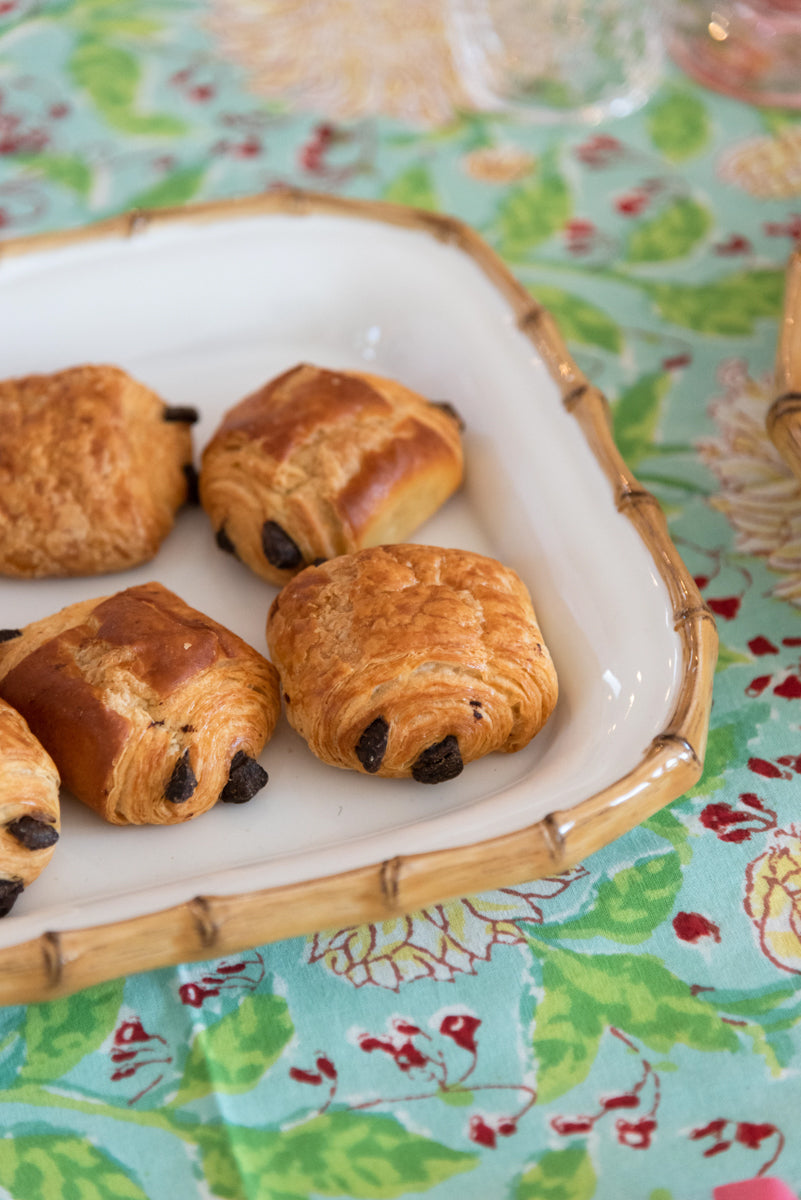 Juliska Classic Bamboo Natural Rectangular Platter displayed on top of tablecloth with pastries