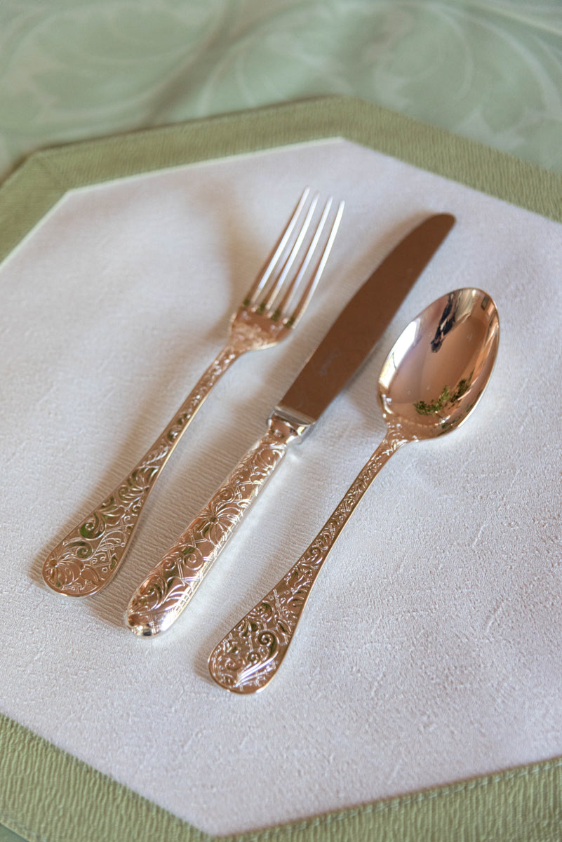 Christofle Jardin D'Eden Flatware on top of placemat