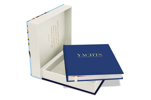 Yachts: The Impossible Collection book in an open box 