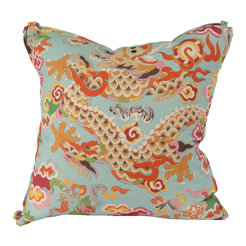 Aqua background with orange dragon pattern, front of pillow