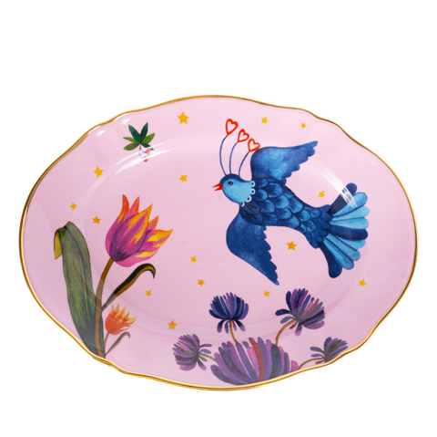 oval platter with pink background and bird with floral pattern