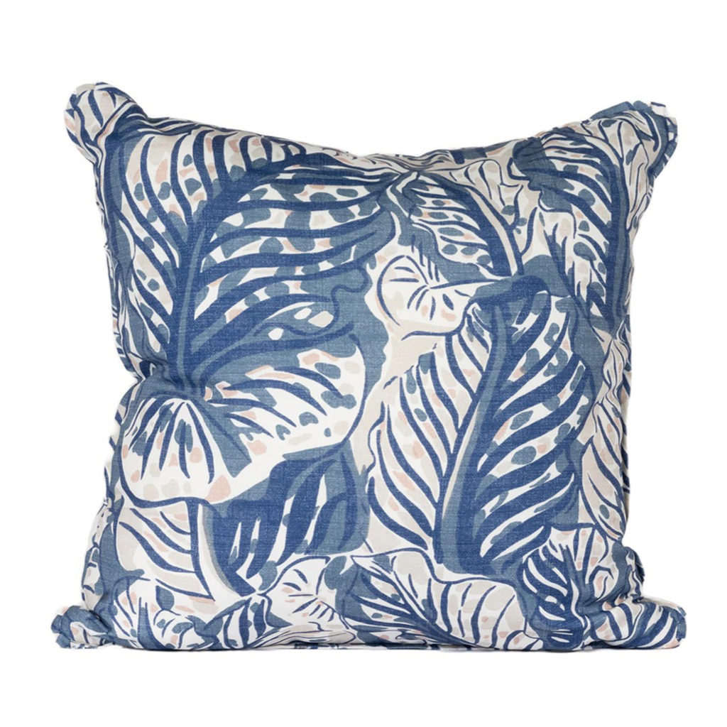 Cream pillow with blue palm leaves