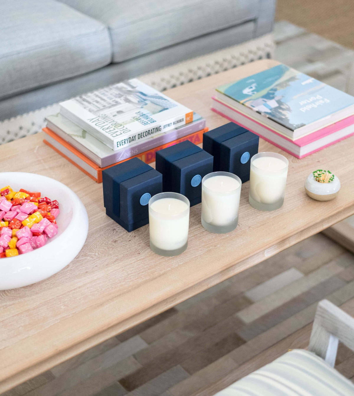 Signature Candle - Morning, Noon, and night styled on coffee table 