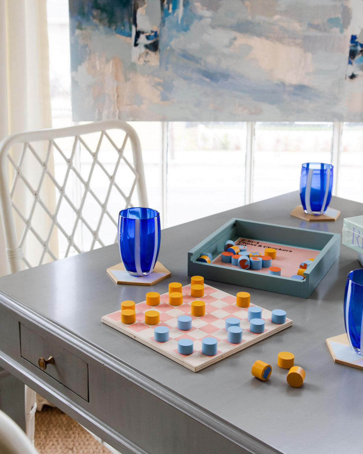 Blue and White Striped Tumbler styled on coster on desk