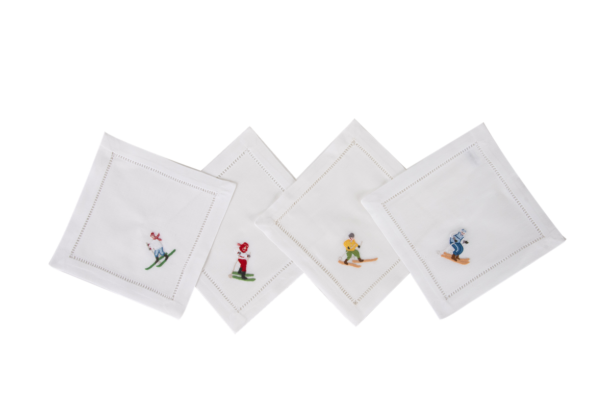 four linen cocktail napkins embroidered with skiers 