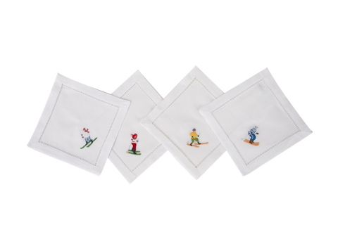 four linen cocktail napkins embroidered with skiers 