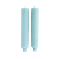two light blue column taper candles 