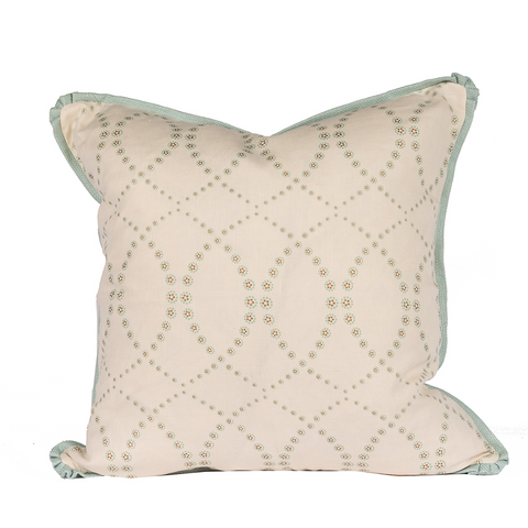 Cream pillow with criss-cross floral designs and sea foam flange