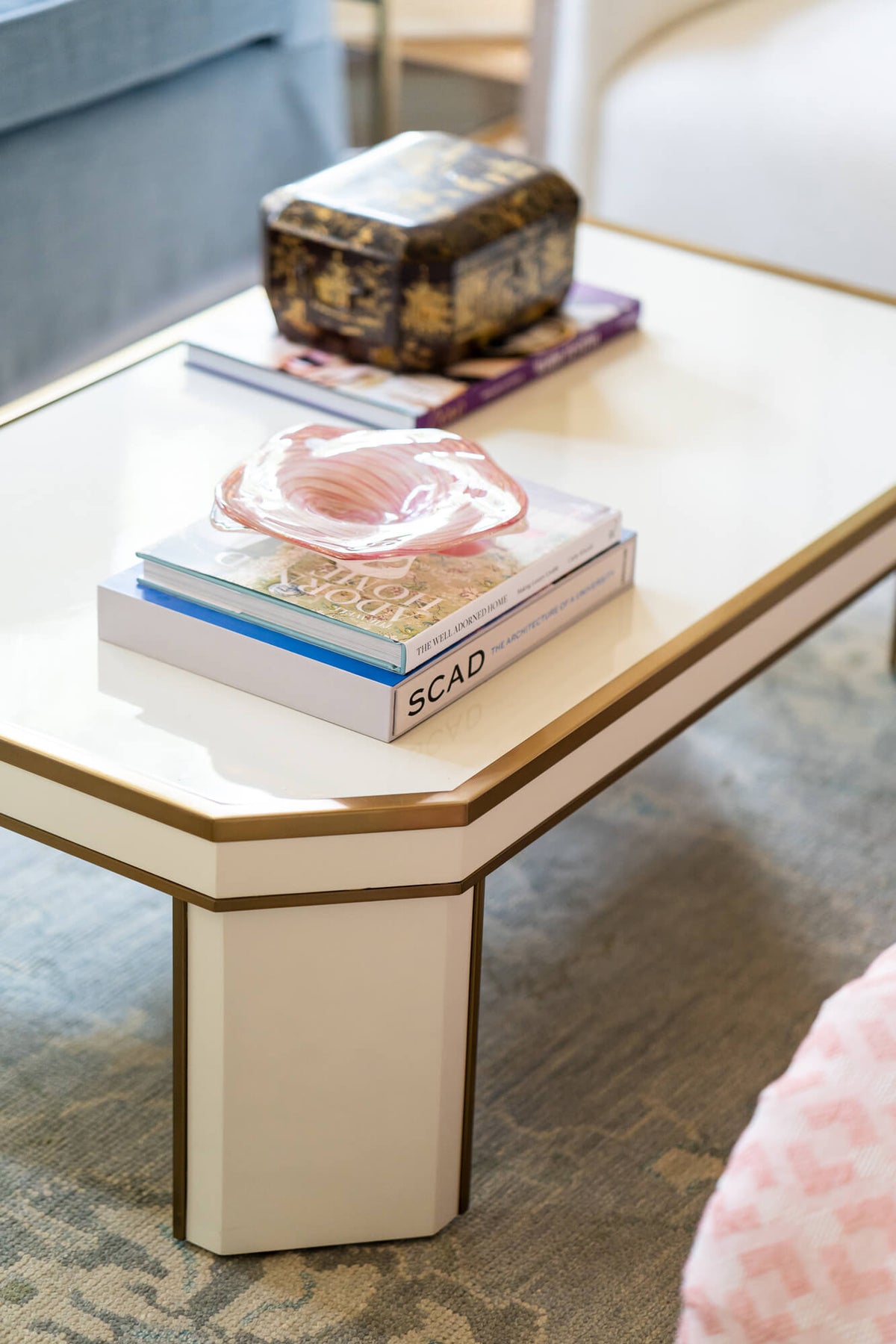 Blue Print Collection Ellie Cocktail Table displayed in living room with decor