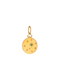 Yellow gold circular charm with engraved star-like shapes with one emerald int he center of star