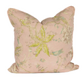 muted pink pillow with floral and bird designs 