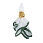 crisp white linen napkin with green scalloped trim and gold flower napkin ring