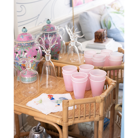 bar cart with pink cups on it