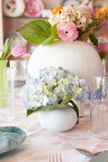 Footed Round Porcelain White Vase paired with large vase and flowers on table