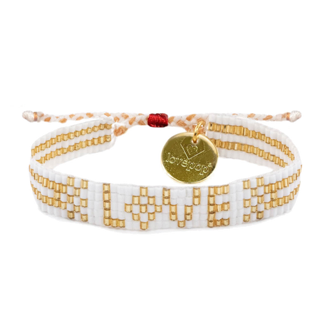 white and gold beaded bracelet with love written on middle