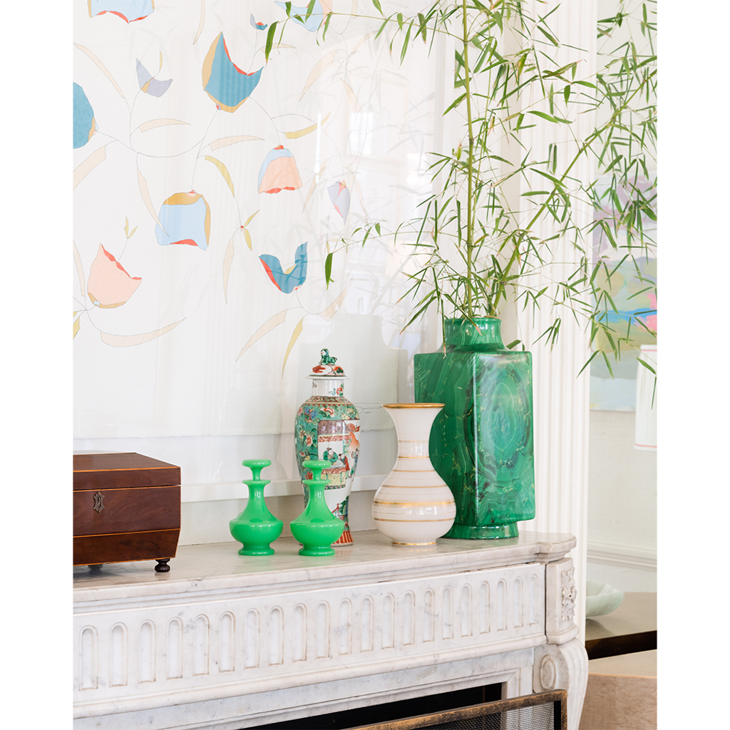 malachite vase styled on fireplace mantle