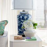 Ceramic Stone Vase with Handles displayed on top of table with books and lamp