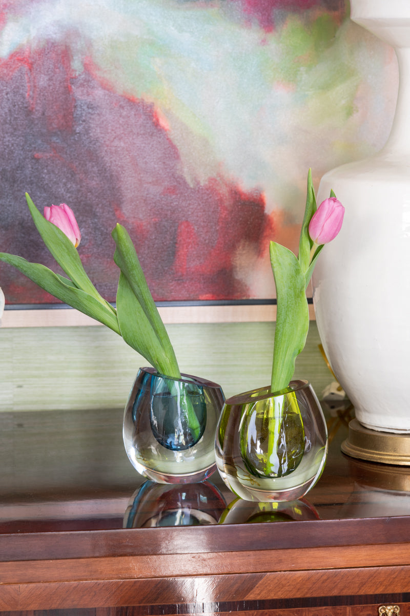 Ocean Hand Blown Glass Vase displayed on top chest with flowers