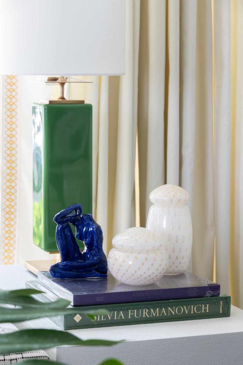 White and Gold Short Dot Glass Box styled on top of books with tall white and gold glass vase