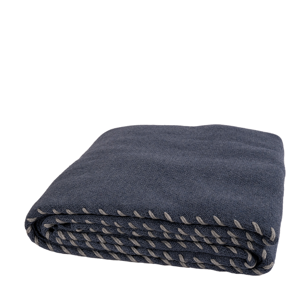 navy blue throw with grey contrasting stitch