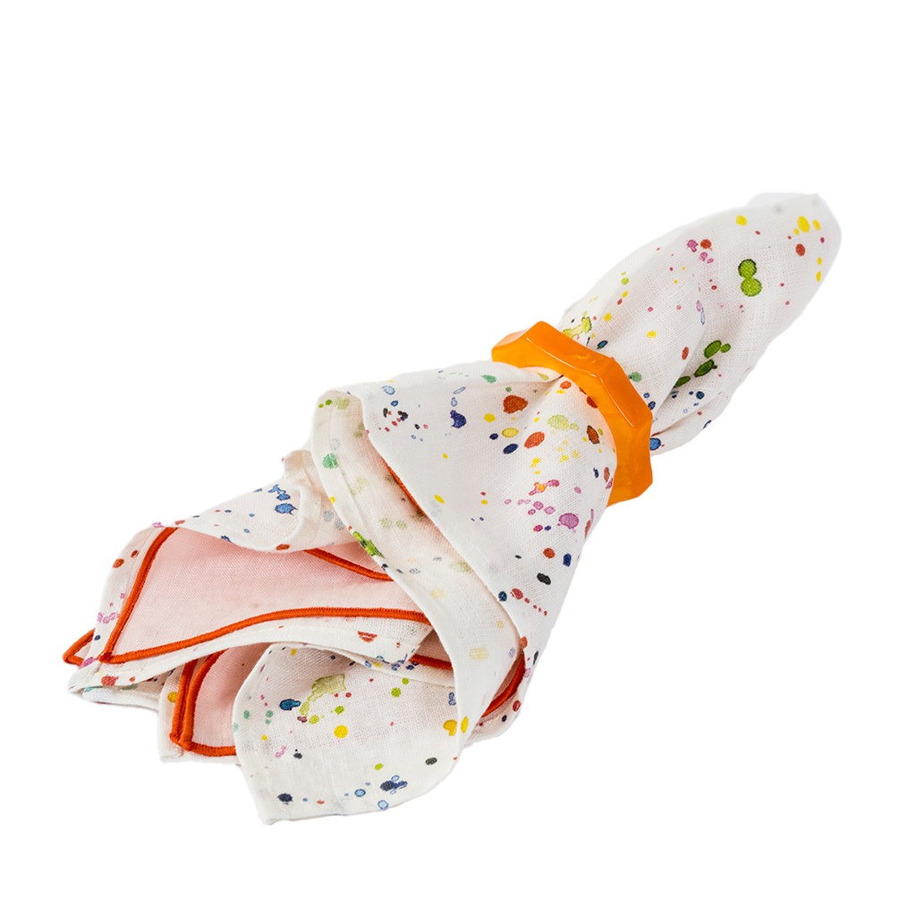 Orange Acrylic Napkin ring with white paint splatter napkin