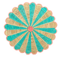 Pink, Natural, and Blue Woven Scalloped Placemat that looks like a flower. 