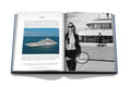 Yachts: The Impossible Collection book open and showing photo of yacht on open water and two women playing tennis on yacht