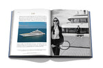 Yachts: The Impossible Collection book open and showing photo of yacht on open water and two women playing tennis on yacht