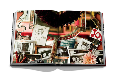 The Big Book of Chic open featuring a close up photograph of a mirror and personal photos