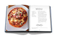 Image from book of eggplant parmesan recipe. the picture of the meal is on the left page, and the recipe is on the right page.