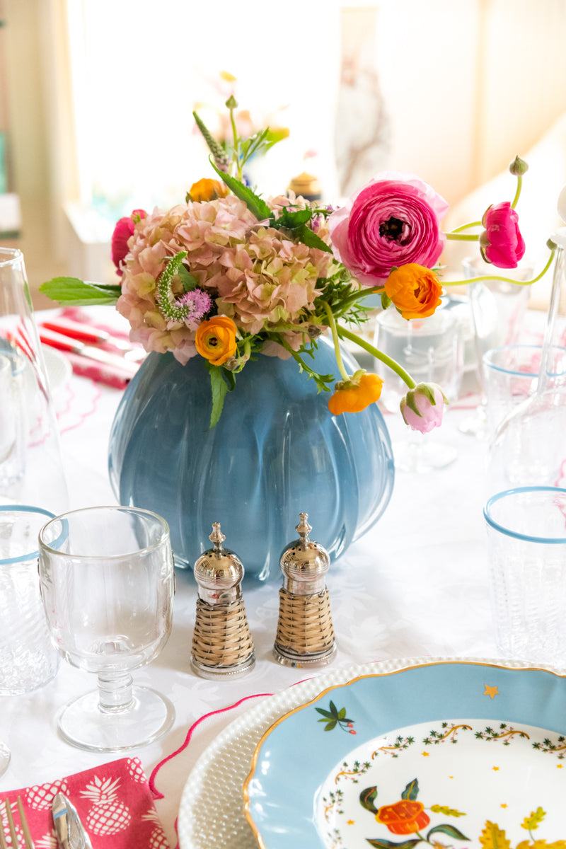 Opaque Blue Rounded Vase in Large displayed on dining table with flowers