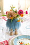 Opaque Blue Rounded Vase in Large displayed on dining table with flowers