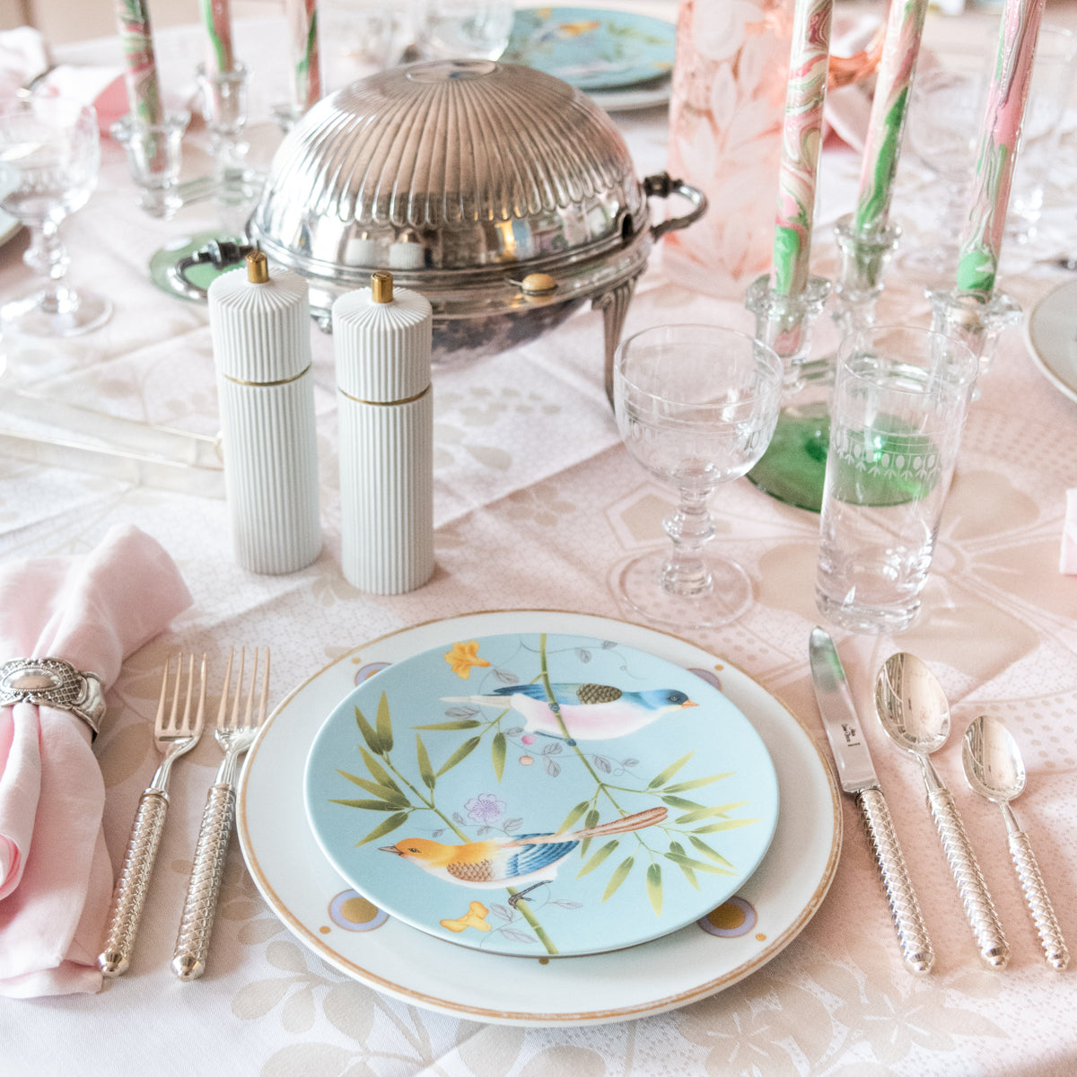 Profile view of Raynaud Paradis Turquoise Dessert Plate in Two Birds pattern and tablescape display