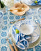 Medallion Blue Tablecloth styled with placemat, dinner plate, soup bowl, flatware and napkin on top