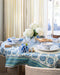 Profile view of Medallion Blue Tablecloth with tablescape display on top