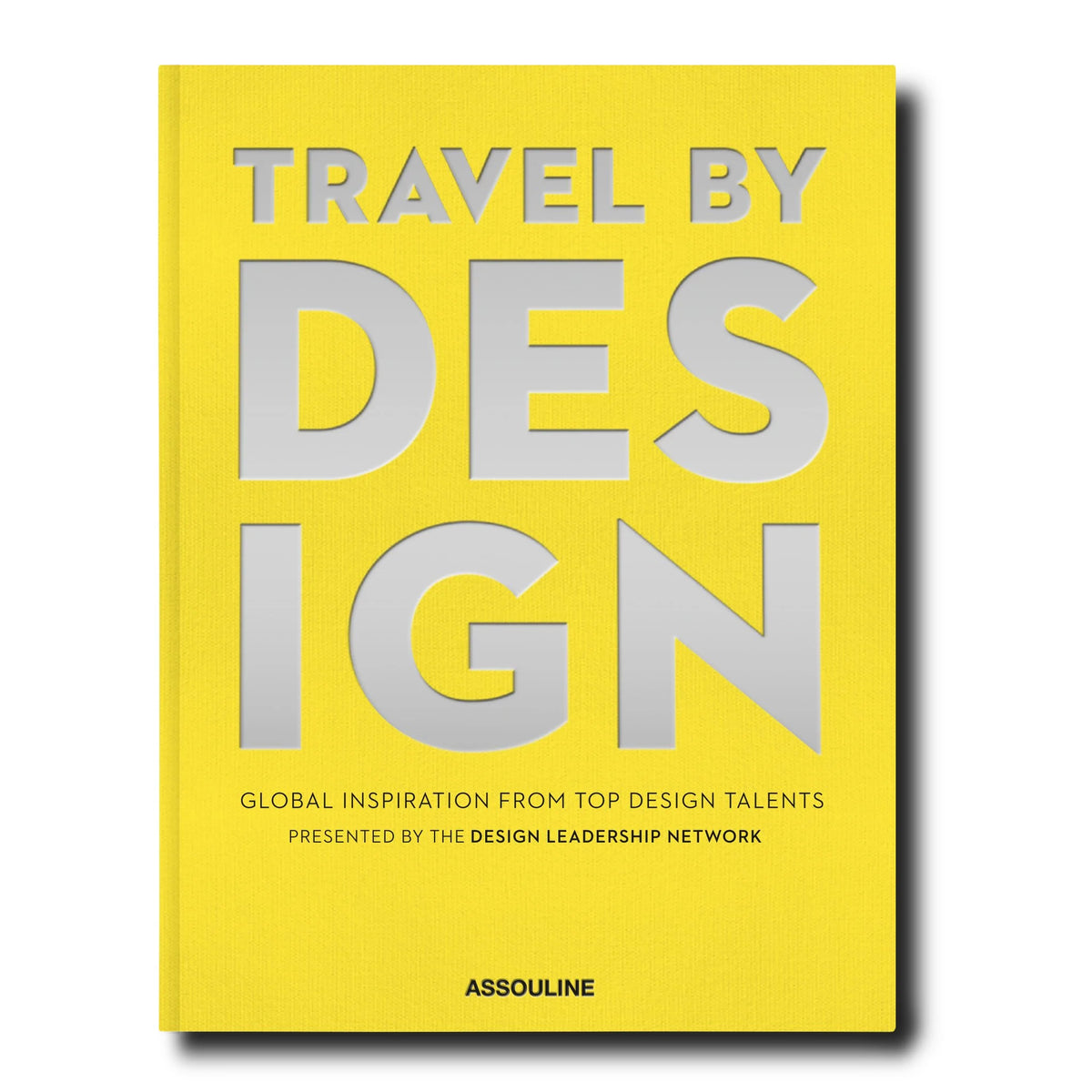 Yellow book with large silver letters spelling "travel by Design"